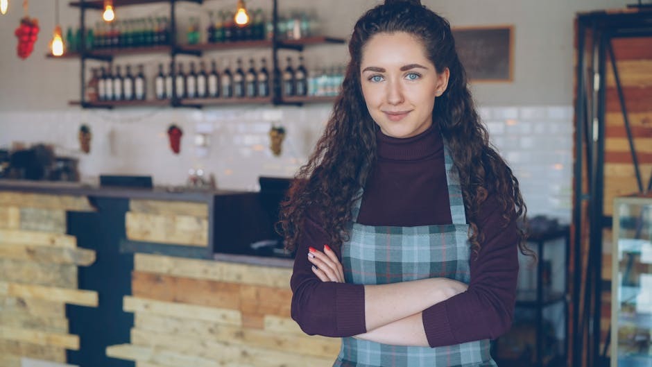An Australian cafe owner working behind the counter of a local hospitality business